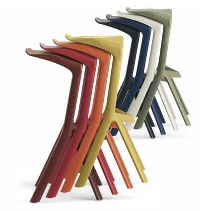 Stacked colorful barstools ideal for a trade show booth or event venue.